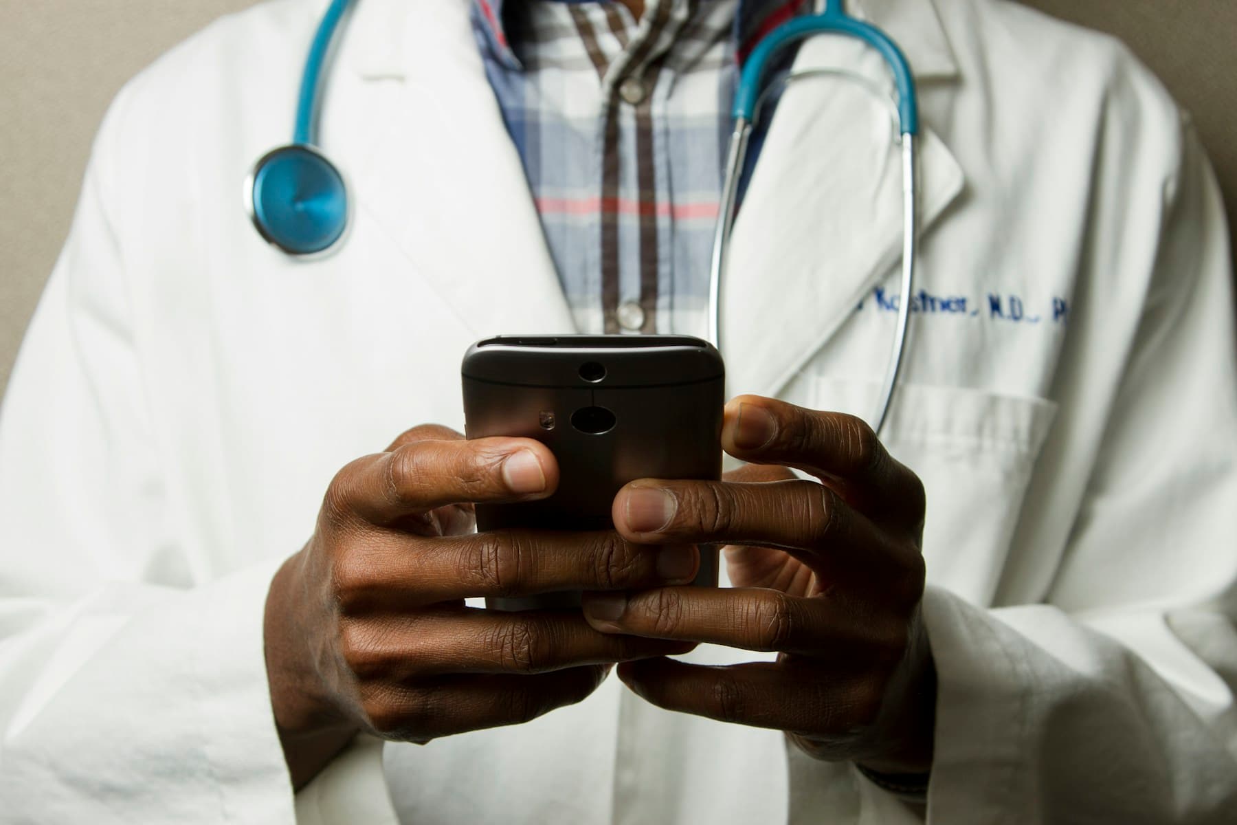 A physician consulting with a patient in a bright office