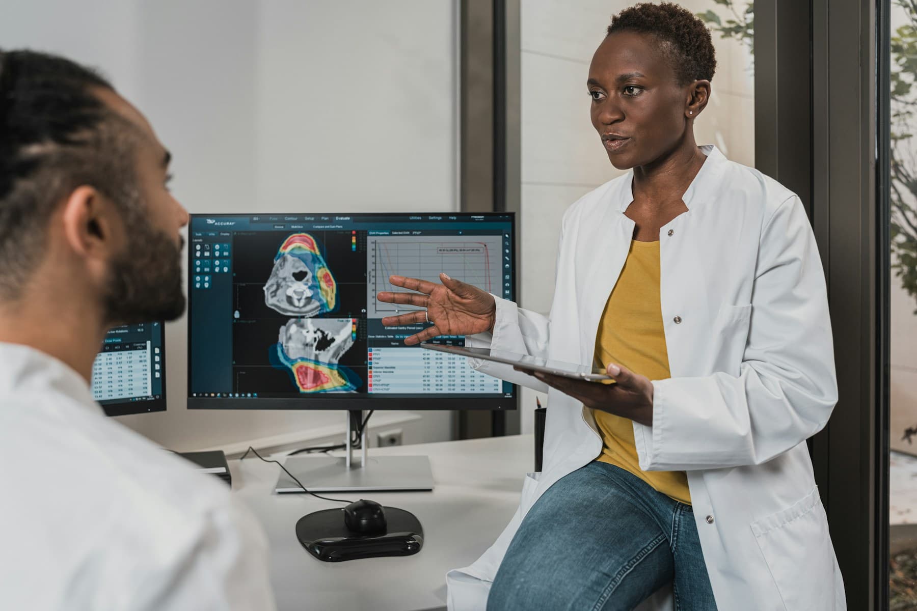 A physician speaking with an older patient